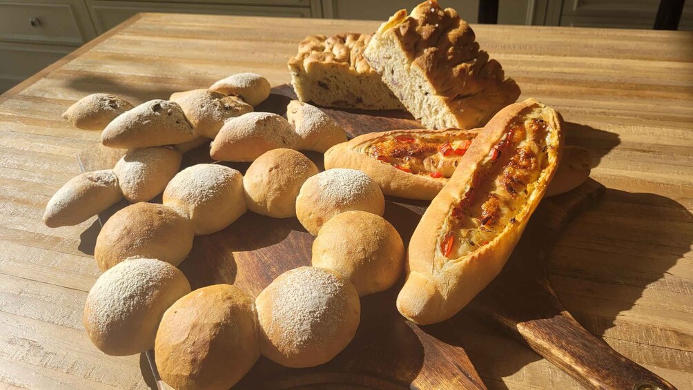 Various baked goods on a wooden table. 5