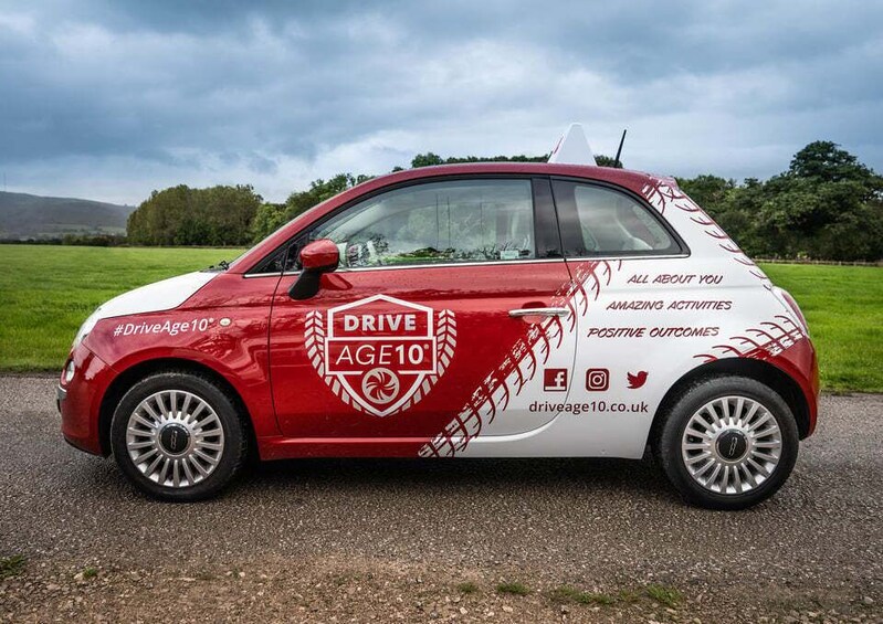 A red and white car with 'Drive Age10' and 'Amazing Activities' on the side. 5