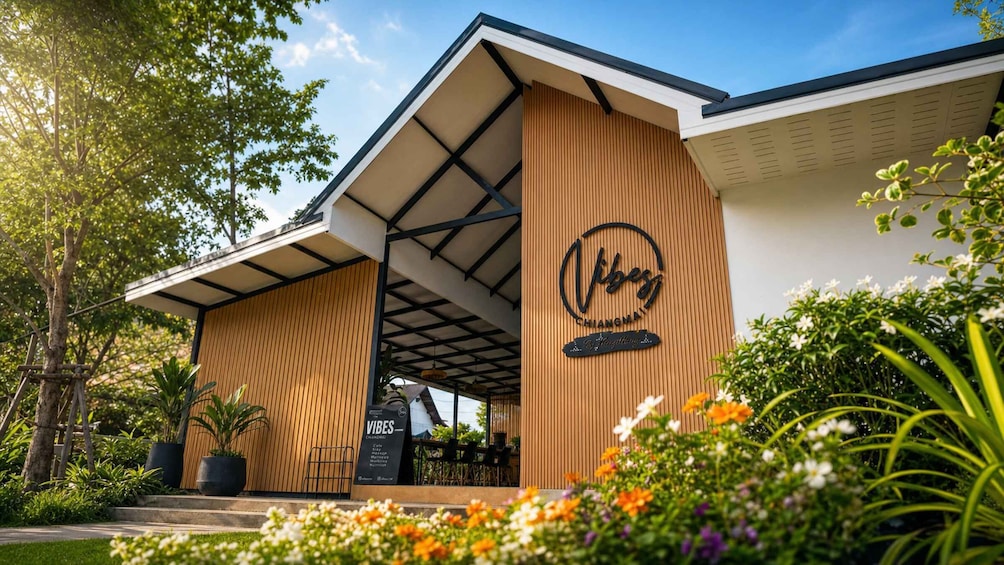 A modern building with a wooden facade and a sign that reads 'Vibes.' 2