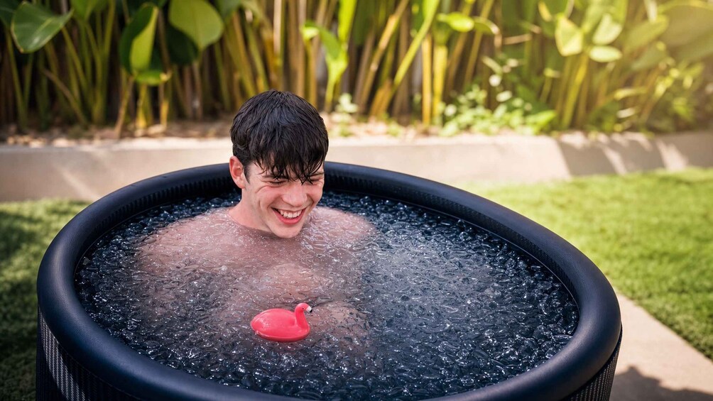 A person in a hot tub with a red duck float. 5