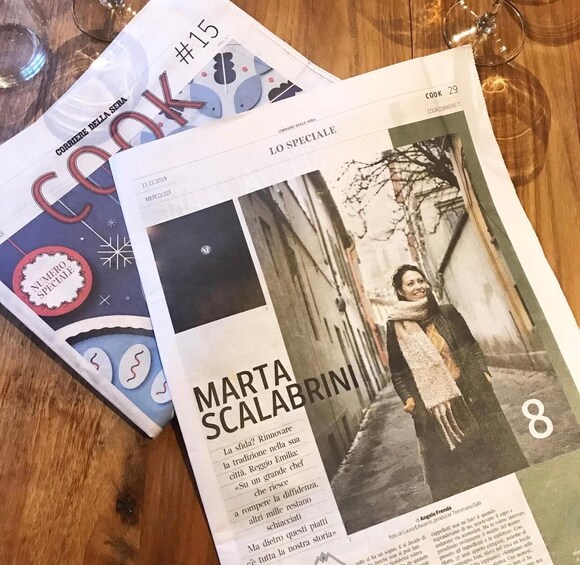 A magazine with a winter-themed cover and a page featuring a person in a snowy setting. 5