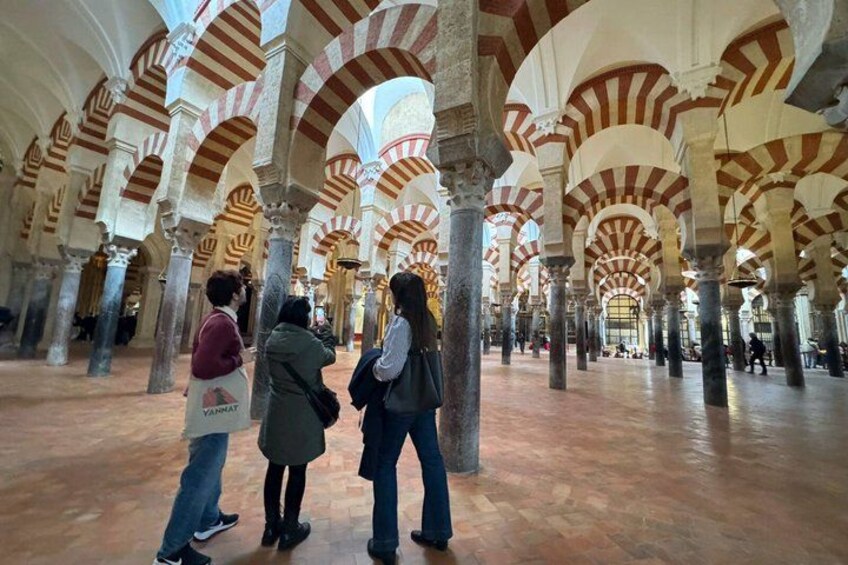 A historical building with arches and columns. 4