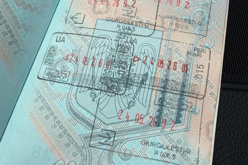 A passport with a visa stamp and a watermark. 3