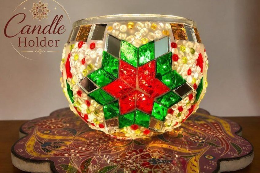 A mosaic candle holder with a star pattern. 2