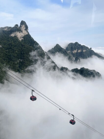 A cable car system amidst misty mountains. 4