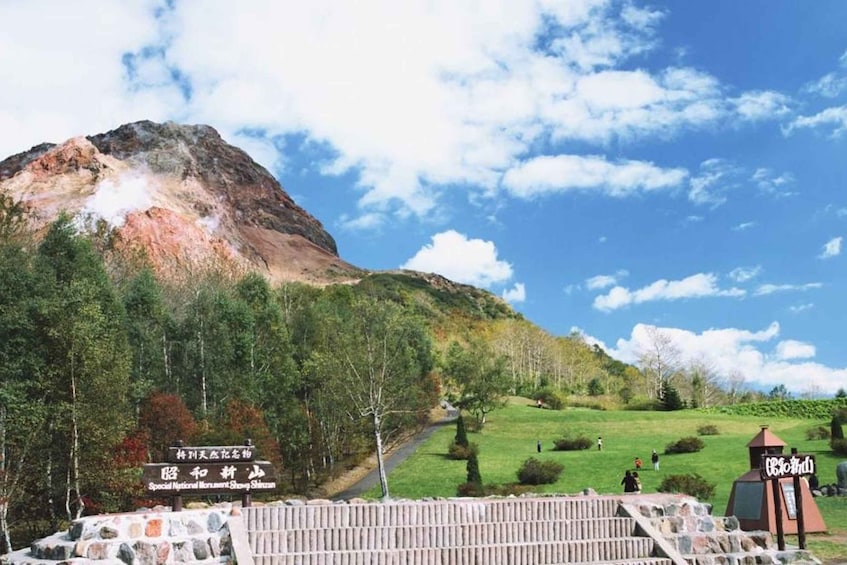 A mountain with a sign for the Special National Monument Shizhan. 3