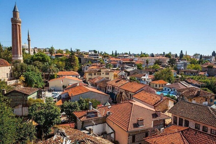 A densely packed urban area with traditional architecture, including a prominent minaret. 5