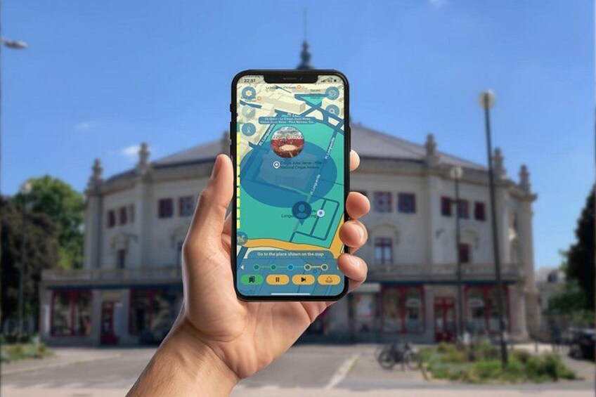 A hand holding a smartphone displaying a map with a location pin, a bicycle, and a building in the background. 3