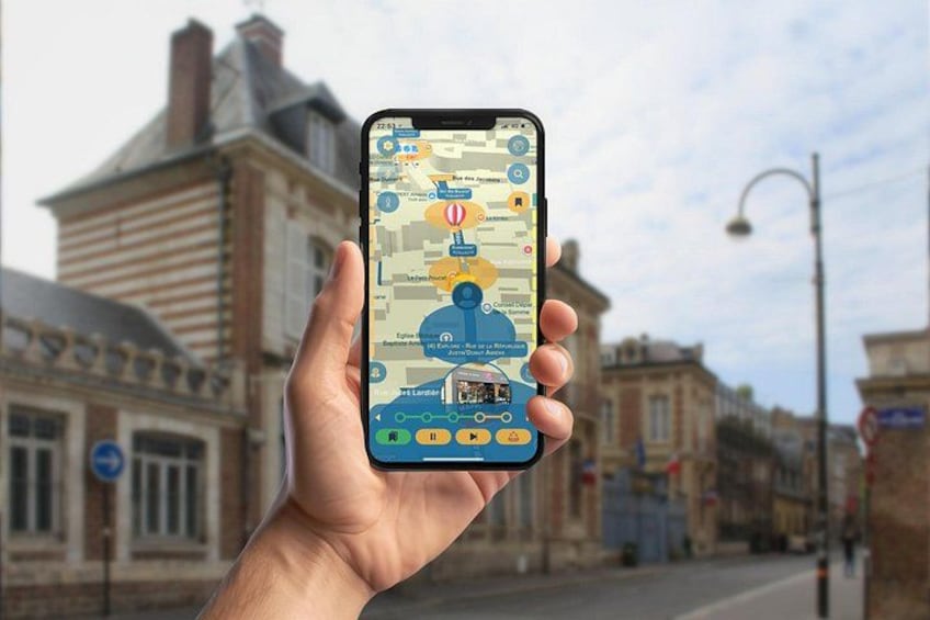 A hand holding a smartphone displaying a map with various points of interest. 1