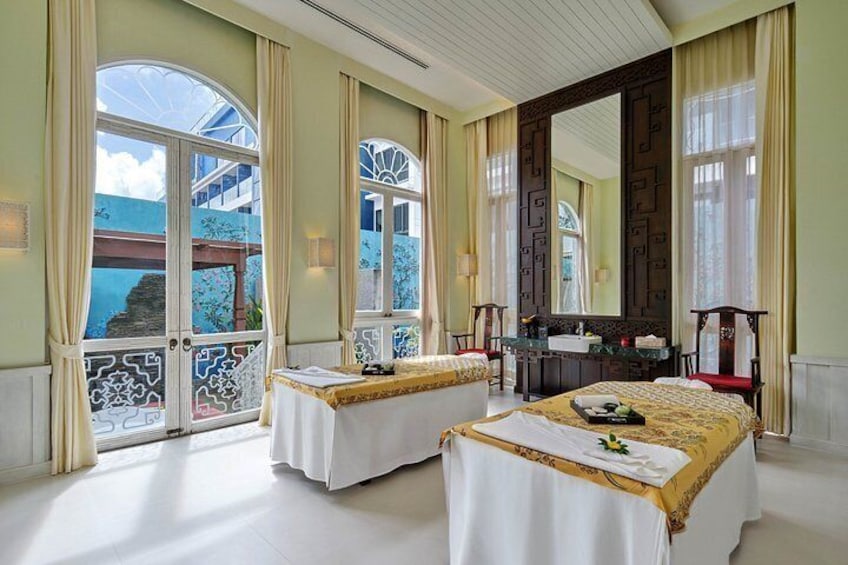 A hotel room with two beds, a large mirror, and a balcony with a view. 5