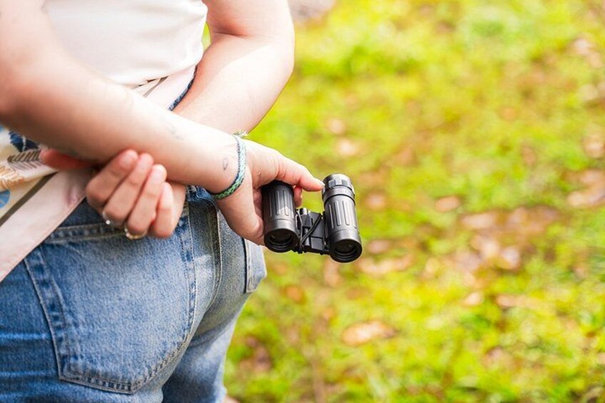 A person holding binoculars. 3