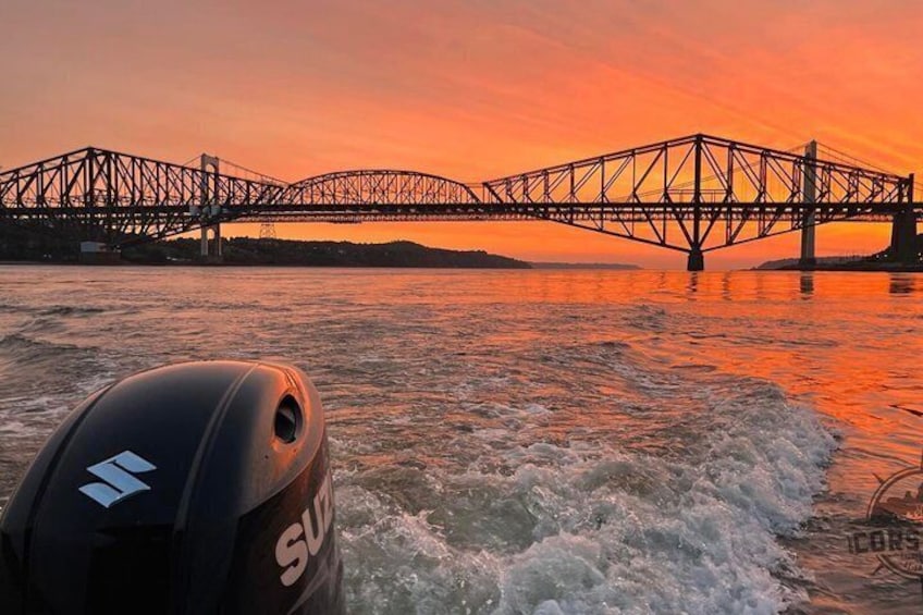 A bridge over water during sunset. 1