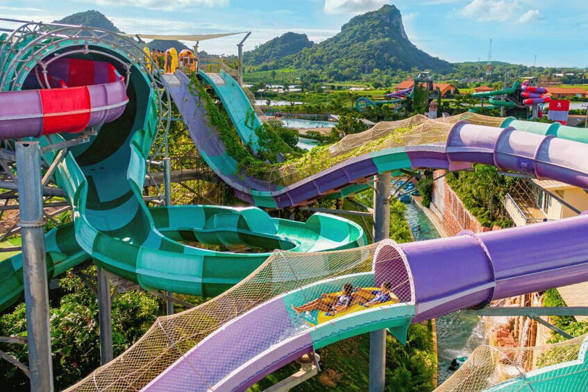 A water park with multiple slides and a river. 1