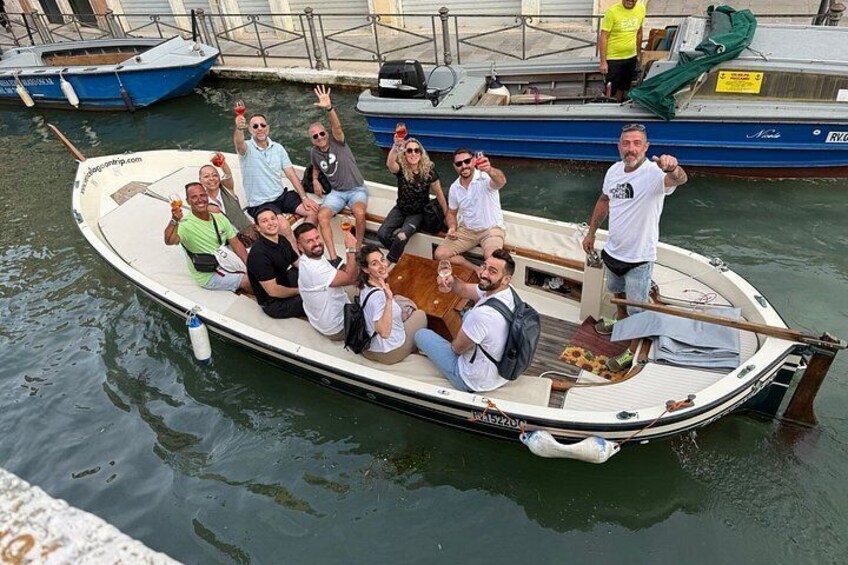 A group of people on a small boat in a harbor. 5