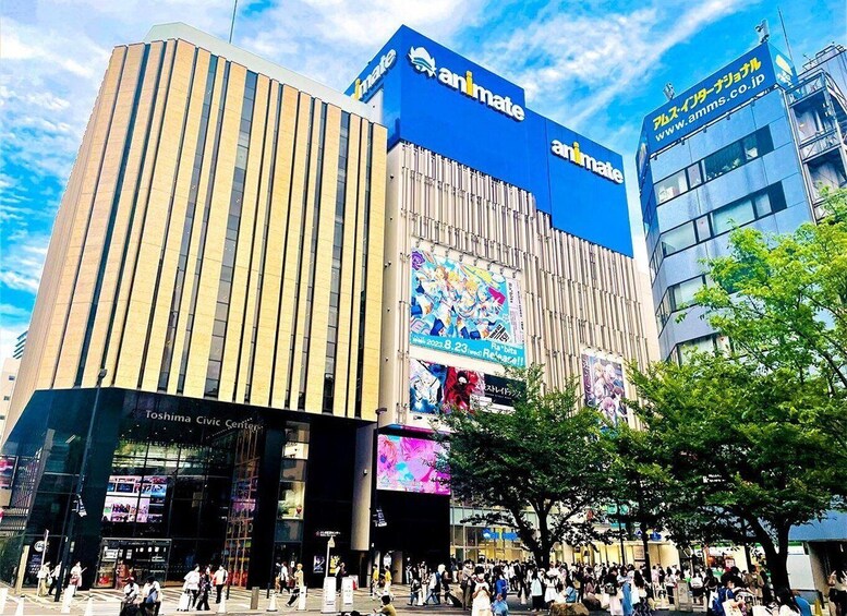 A busy urban street with a prominent Animate building featuring large digital billboards. 5