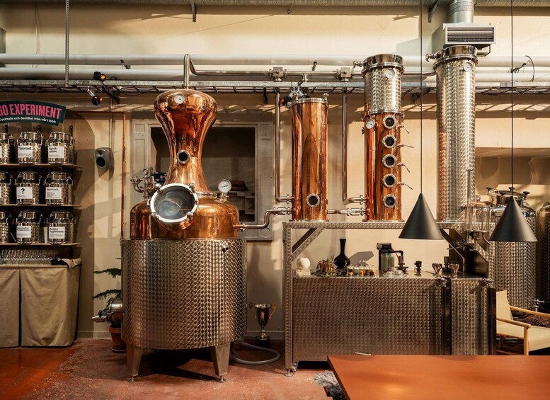 A distillery with copper stills, a sign reading 'GO EXPERIMENT,' and shelves with labeled bottles. 1