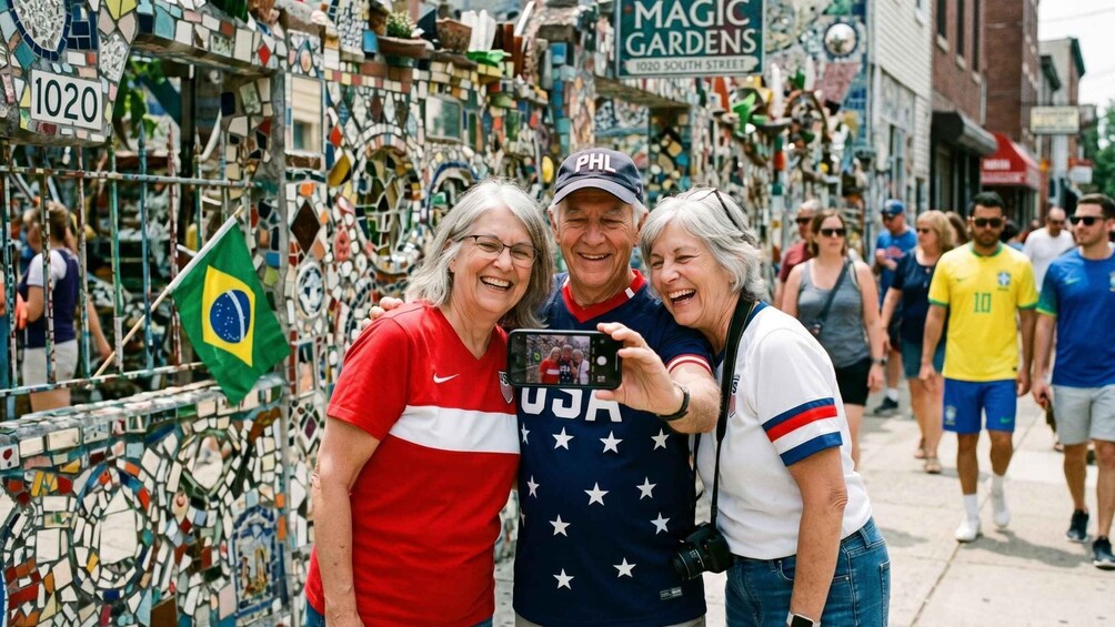 A street with a mosaic wall, a Brazilian flag, and people taking a photo. 5