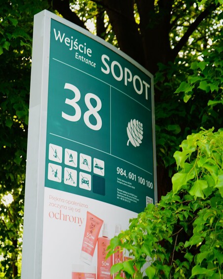 A sign with 'Wejscie Sopot' and the number '38' indicating a location or entrance. 3