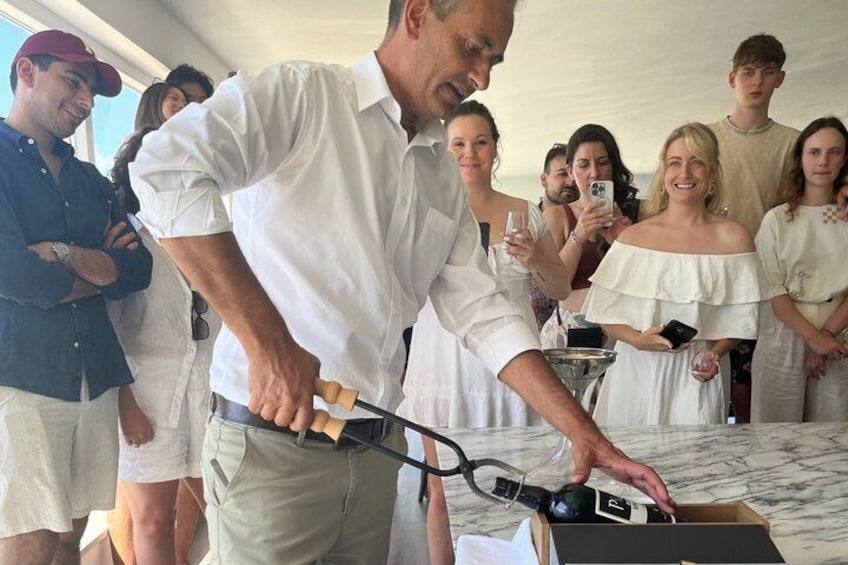 A man cutting a cake with a knife. 3