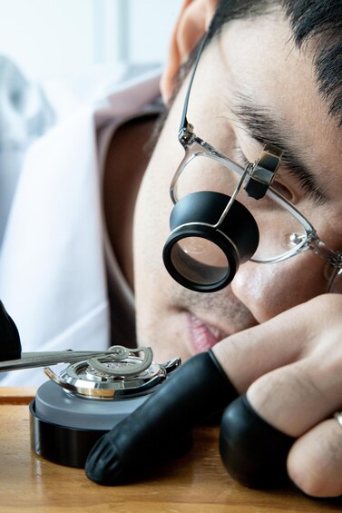 A person using a microscope. 4