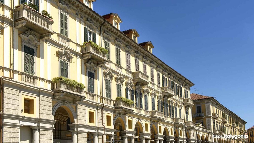 A historic building with ornate balconies and arched windows. 2