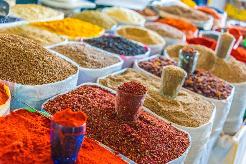 A variety of spices displayed in containers. 3
