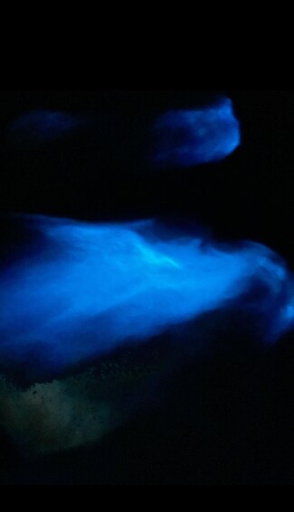 A dark scene with blue light effects. 3