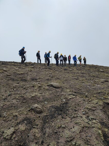 A group of hikers on a rocky mountain trail. 1