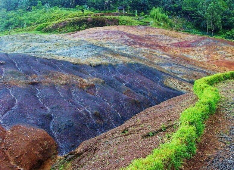 A colorful geological formation with distinct layers of rock. 1