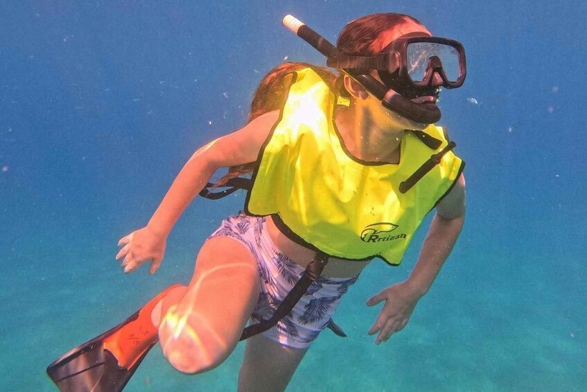 A person snorkeling underwater. 2