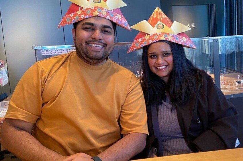 Two people wearing paper hats. 4