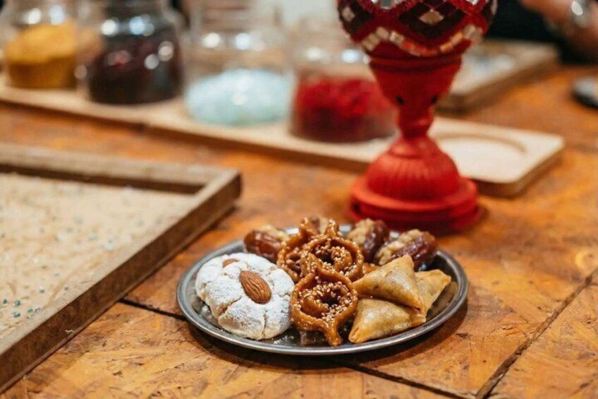 A plate of pastries on a wooden table. 5