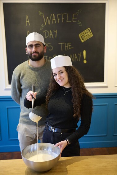 Two people cooking, one holding a ladle over a bowl. 3