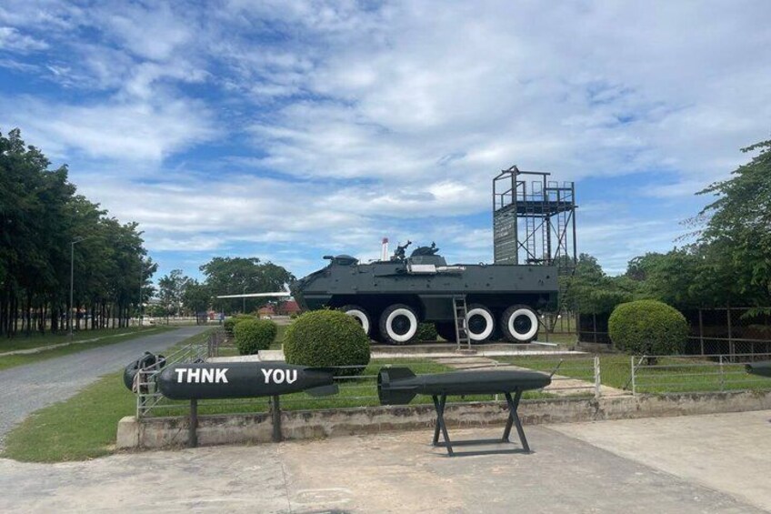 A military vehicle with 'THANK YOU' on a bench in front. 2