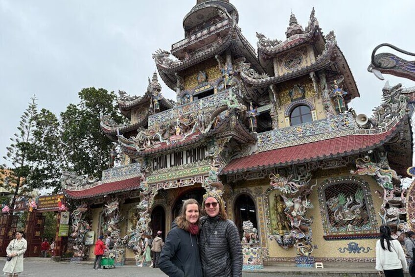 A multi-tiered pagoda with intricate designs and statues. 3