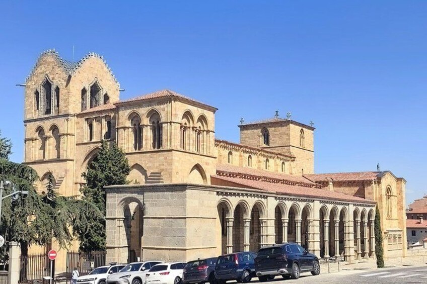 A historic church with a prominent bell tower and arched windows. 2