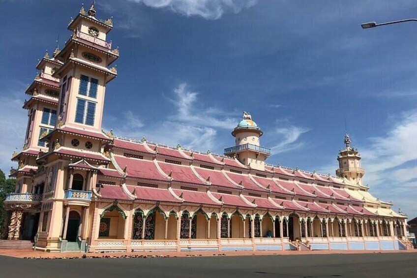 A large, ornate building with multiple towers and a red roof. 5