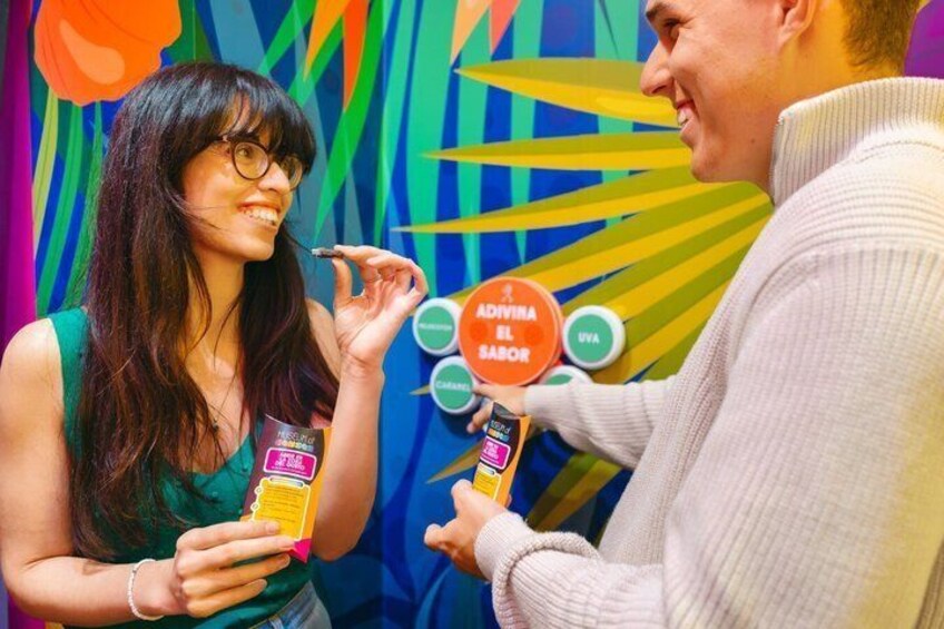 Two people holding products with a colorful background. 4