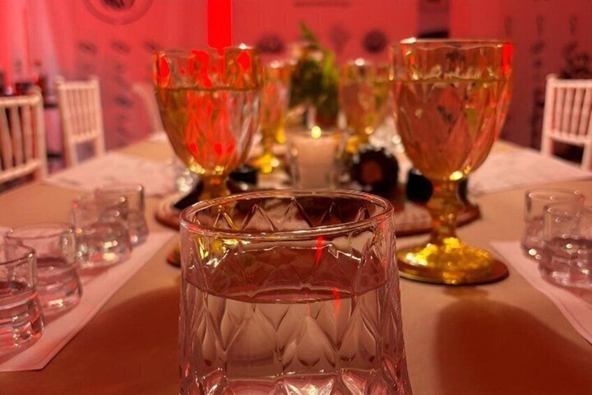 A table with crystal glasses and a candle. 3