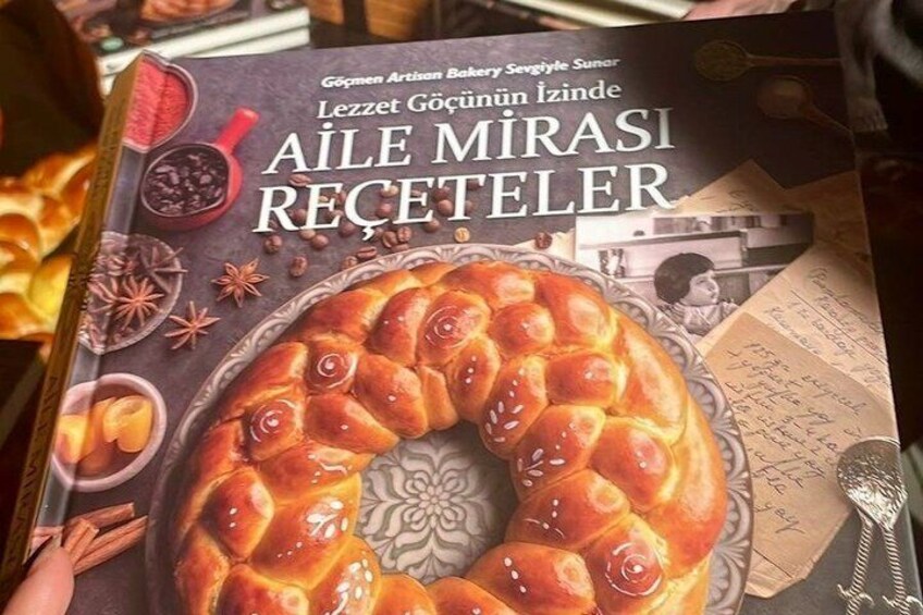 A cookbook cover with a braided bread and spices. 4