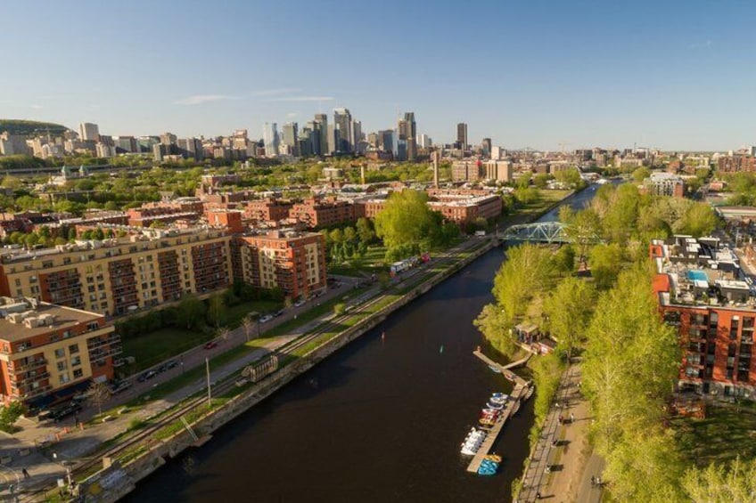 A river running through a city with buildings and a bridge. 3
