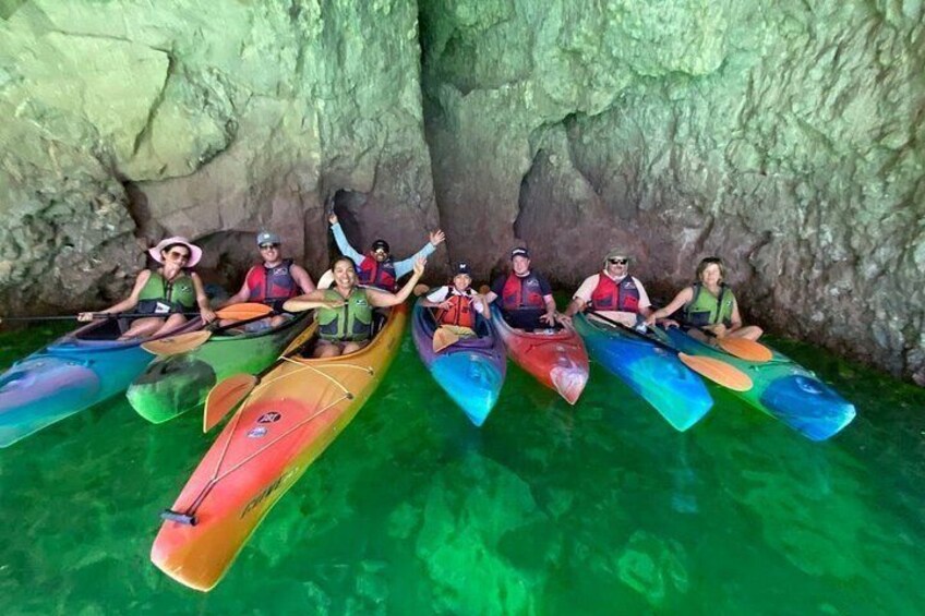People in kayaks in a cave. 3