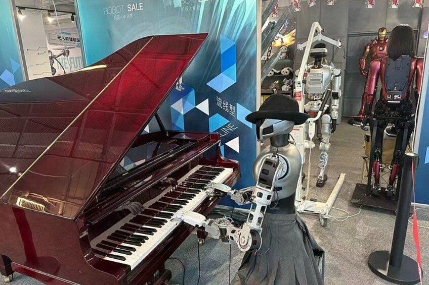 A red grand piano, a robot, and a mannequin in a display. 2