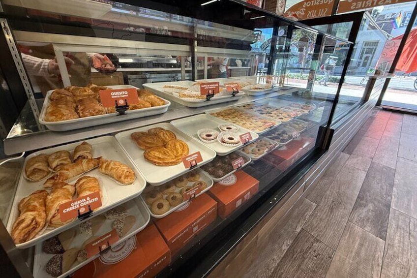 A bakery display case with various baked goods. 5