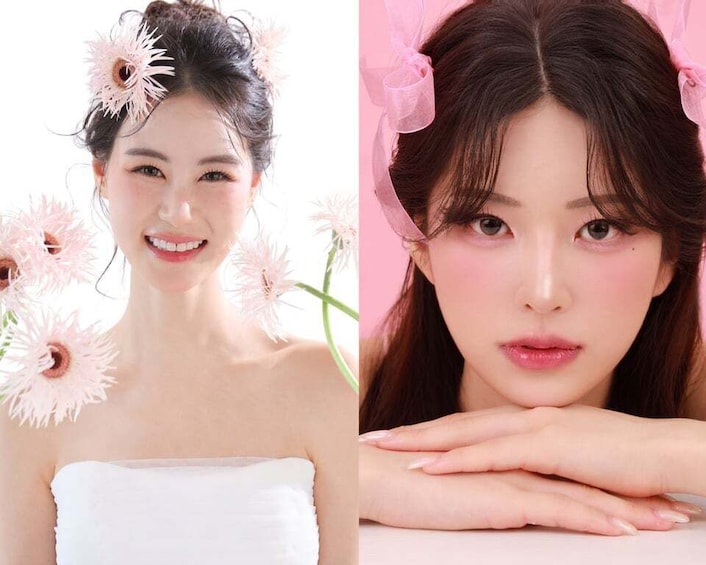 A person with a white strapless top and pink flowers in their hair. 5