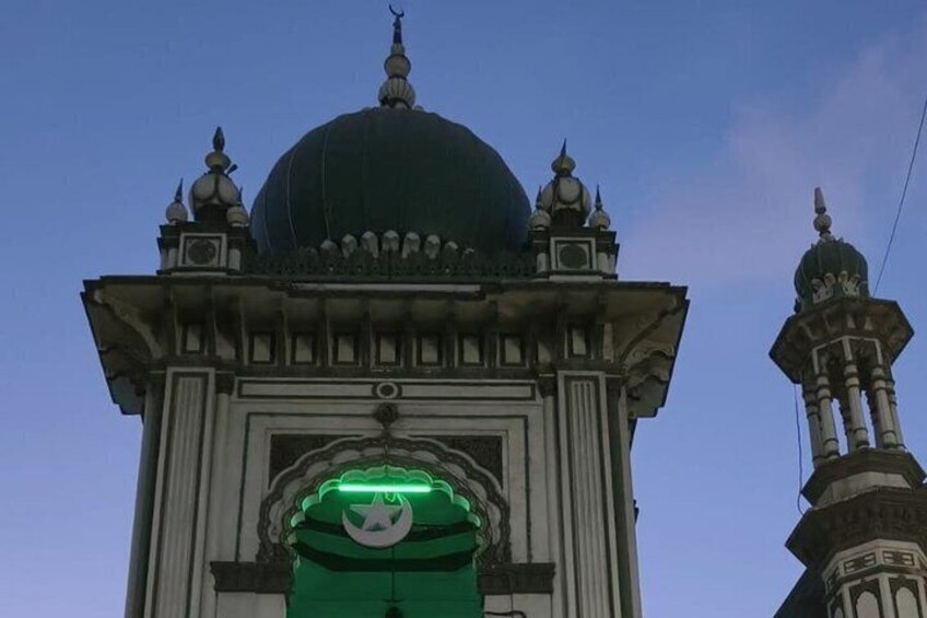 A building with a large dome and ornate architectural details. 2