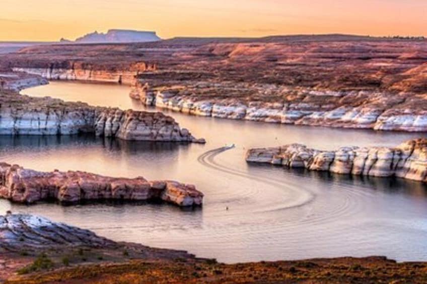 A river meandering through a canyon with layered rock formations. 5