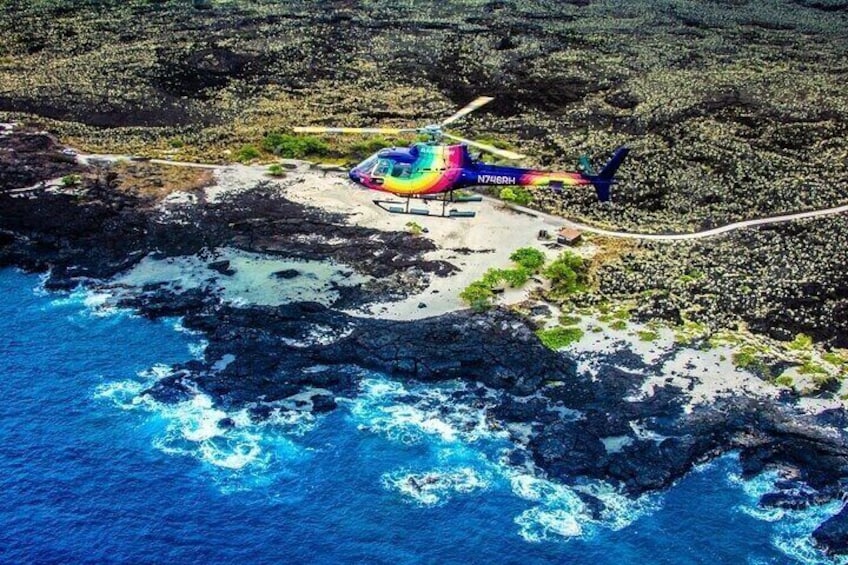 A helicopter on a rocky coastline with waves crashing against the shore. 5