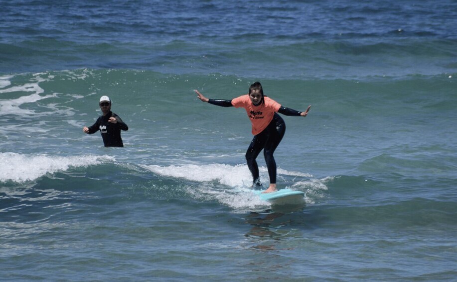 A person surfing on a wave in the ocean. 2