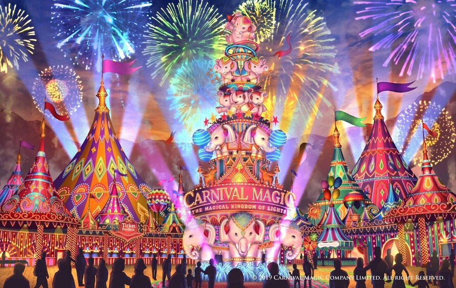 A vibrant carnival with colorful tents and a large elephant statue. 1